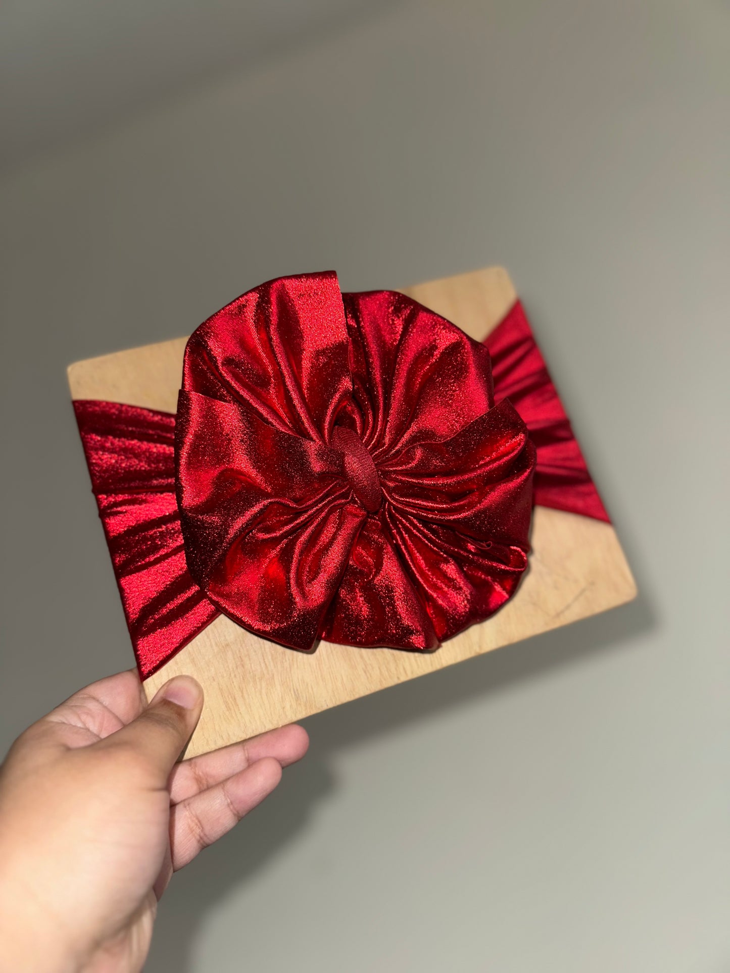 Shiny pleather red bow