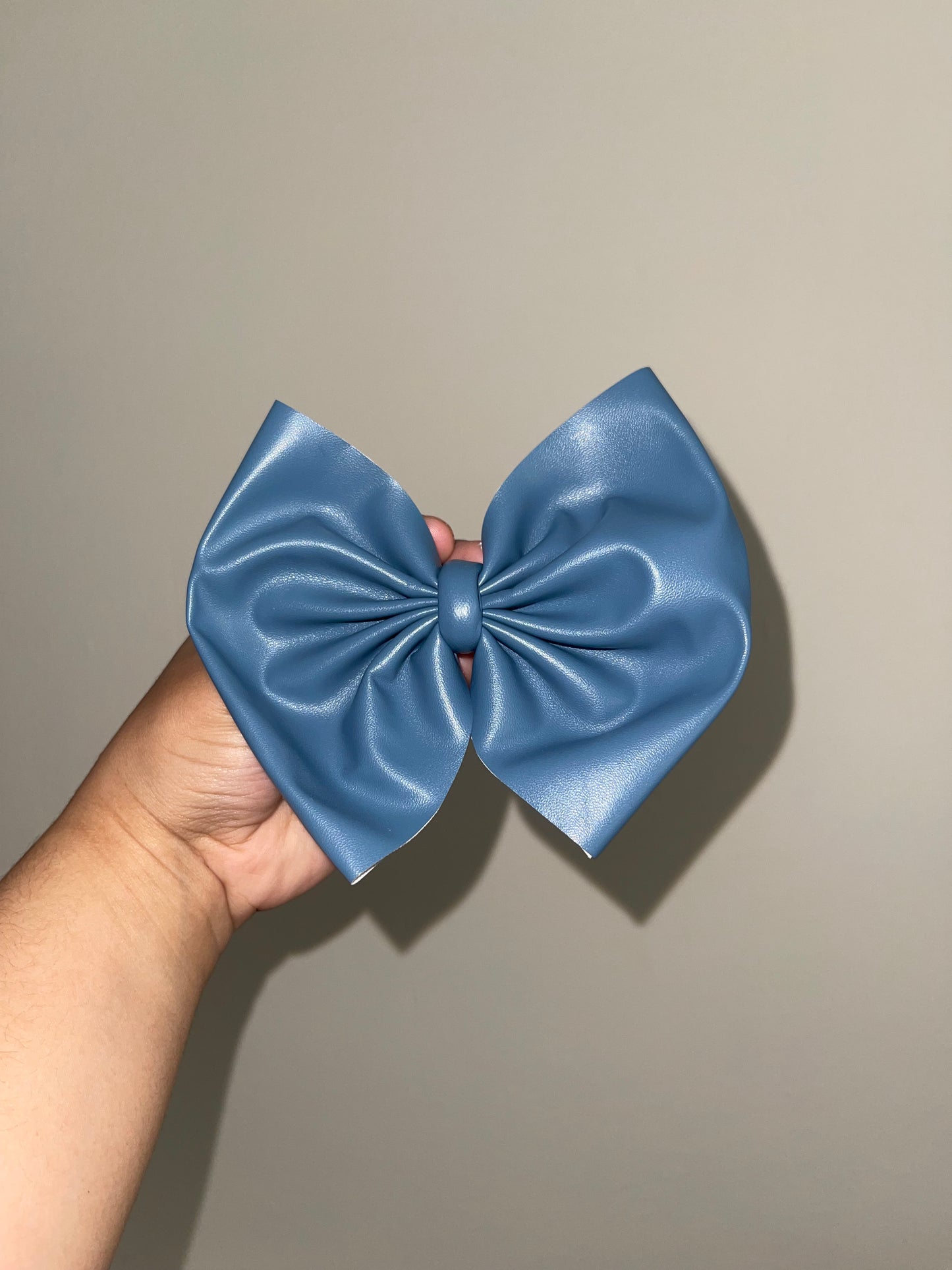 Denim blue pleather bow