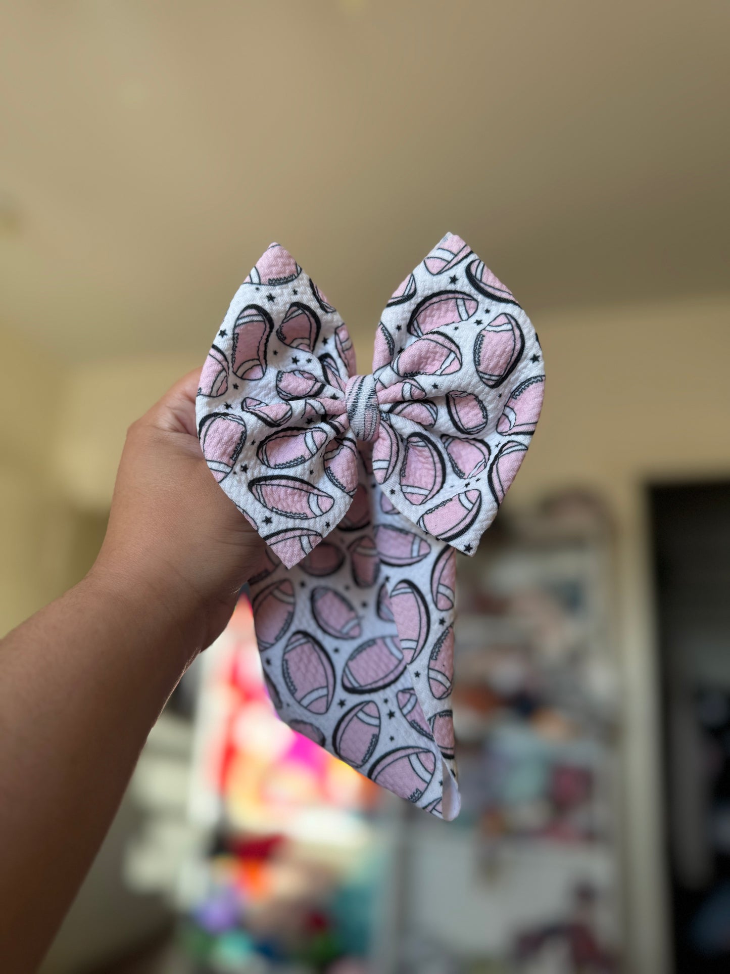 Pink football bow