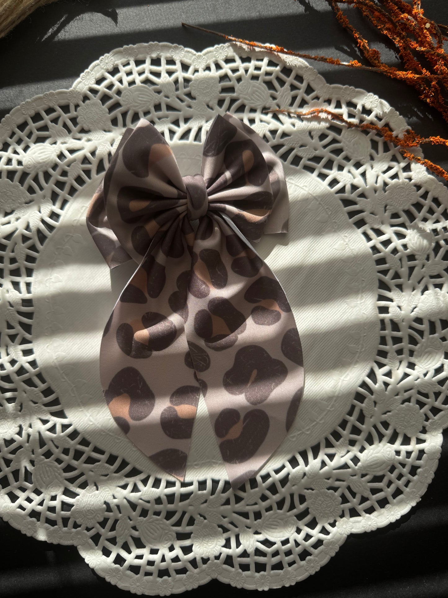 Muted cheetah swim bow