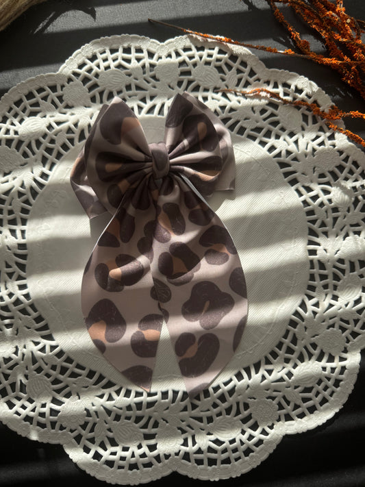 Muted cheetah swim bow
