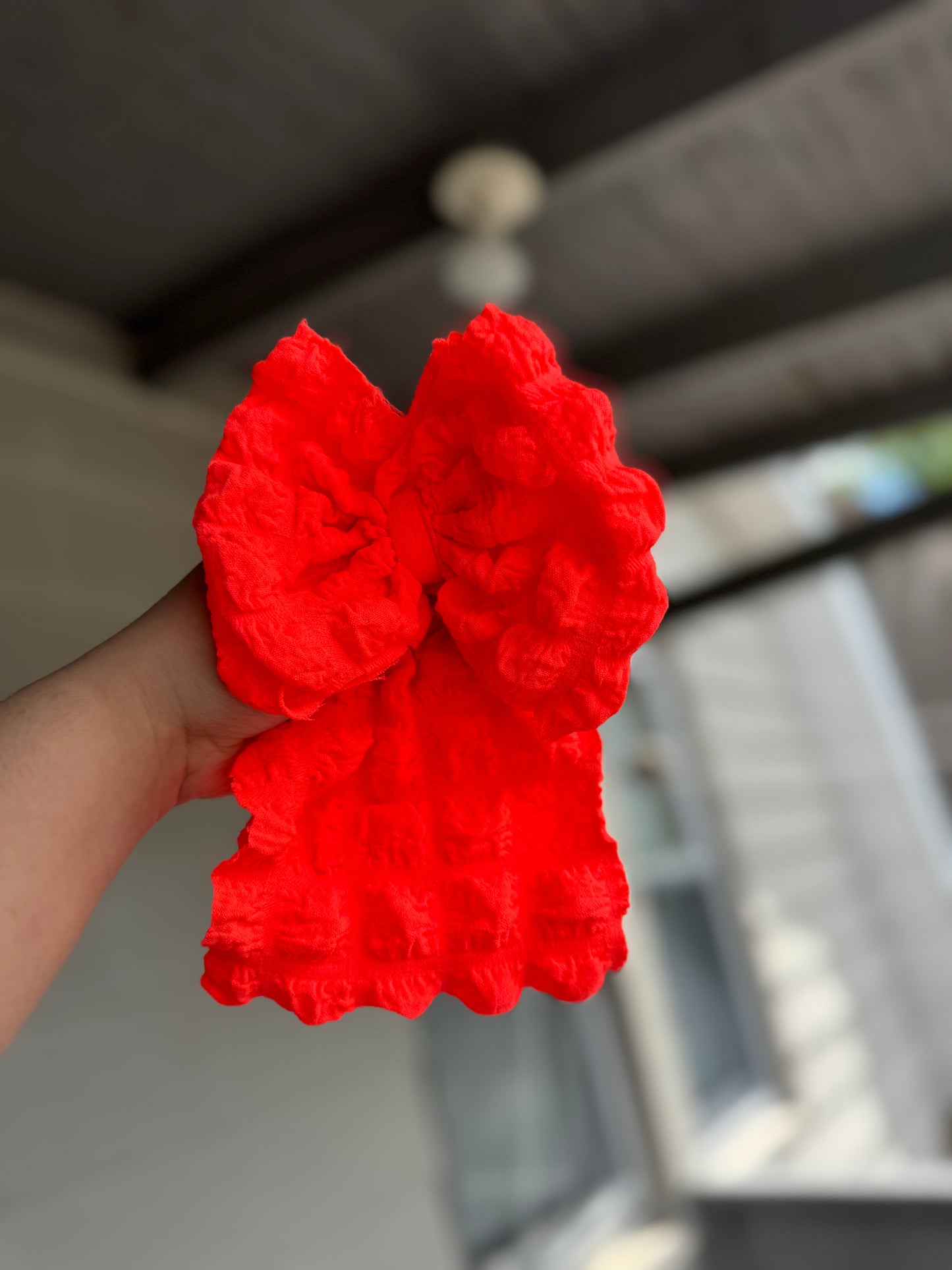 Neon orange popcorn bow