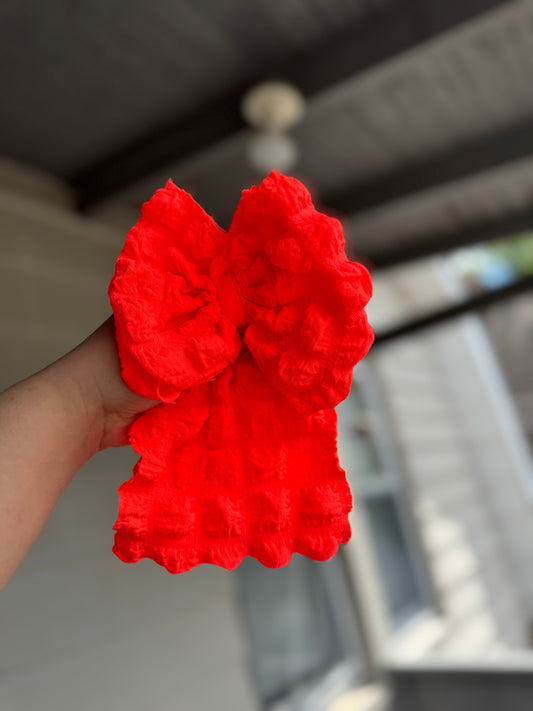Neon orange popcorn bow