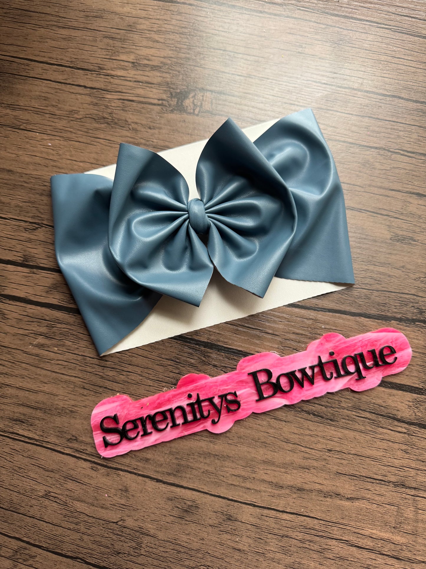 Blue pleather bow