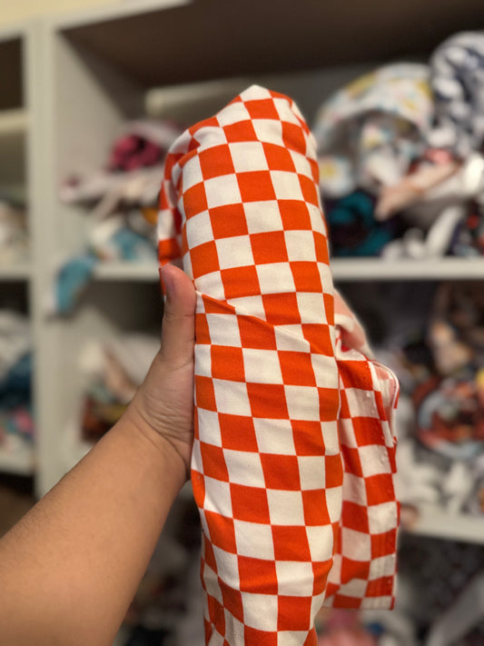 Reddish/orange checkered bow