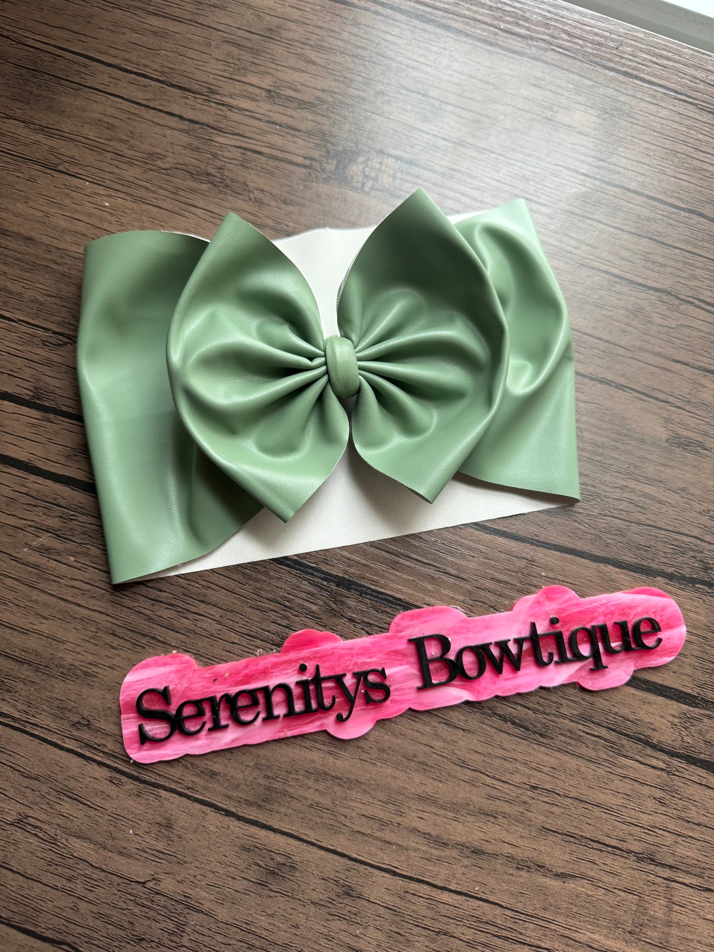 Green pleather bow